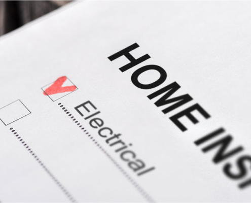 Close-up view of a home inspection checklist marked as checked