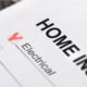Close-up view of a home inspection checklist marked as checked