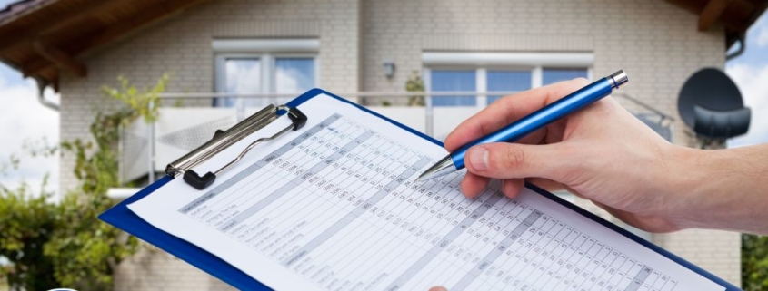 Home inspector filling out a detailed inspection checklist on a clipboard outside a residential property for a professional home inspection