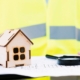 Model house, inspection plans, and magnifying glass symbolizing a professional home inspection in Delaware